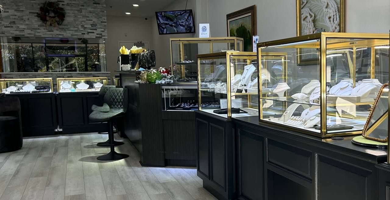 Conrad Jewelry showroom with elegant gold display cases